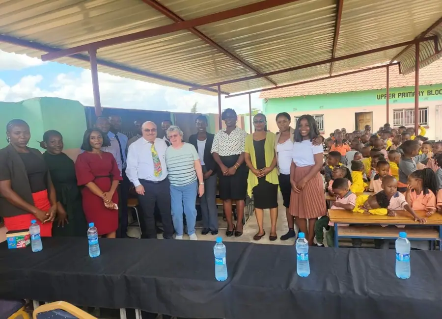 A group photograph taken at the school in front of the upper primary block